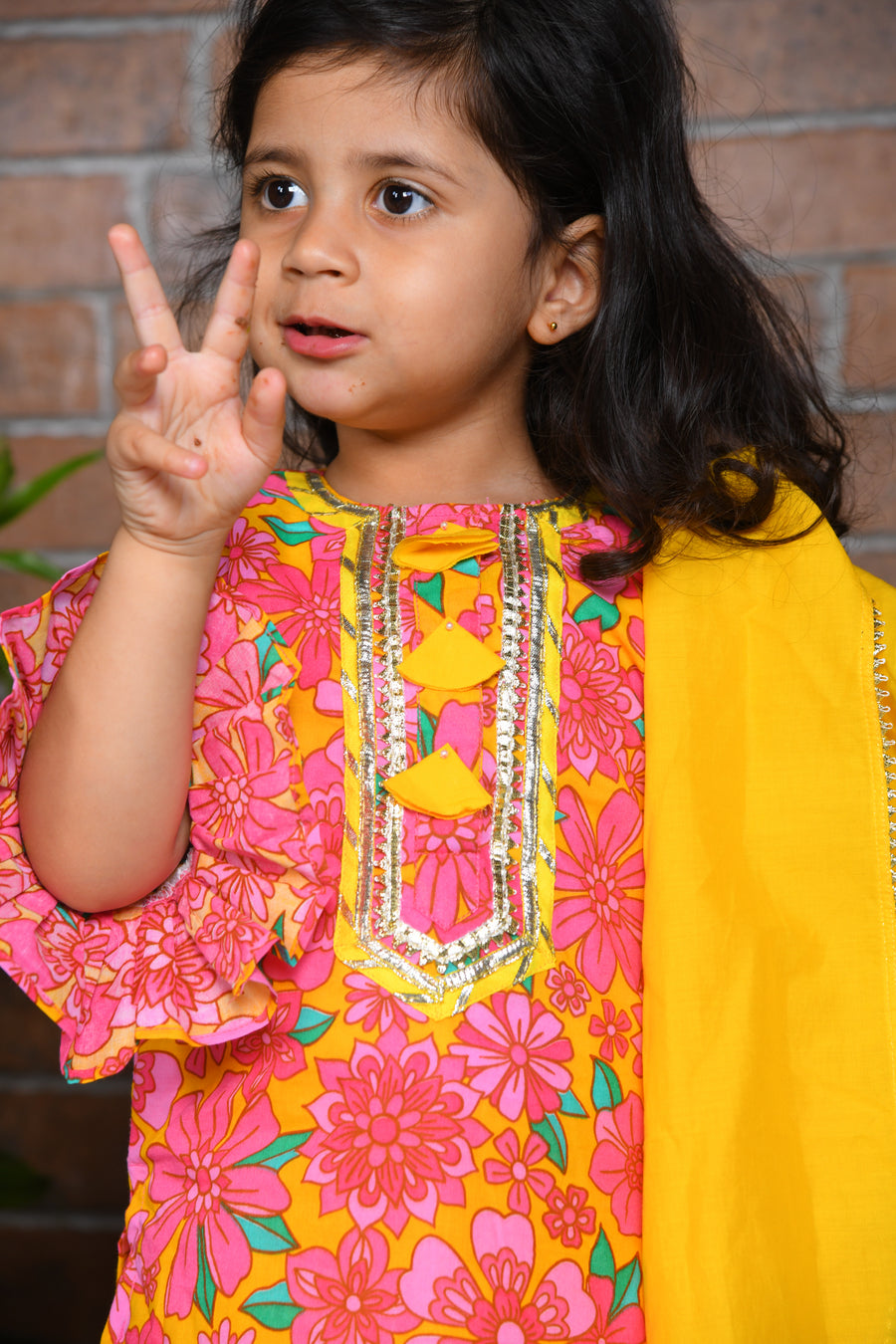 pink floral kurta with yellow lengha and chunni